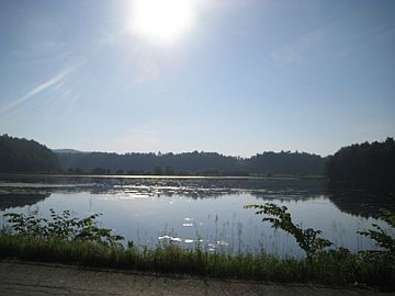 Sun rising over resevoir